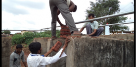 Labourers fixing of GI sheet - July 26, 2014           