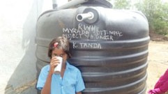 Thippana’s daughter drinking water from the Rain Water harvesting system:  July 30, 2014